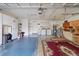 Large two-car garage features ample storage with laundry area, garage door access, and utility sink at 8430 Sw 90Th Ln # A, Ocala, FL 34481