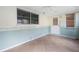 Sunroom with tile flooring features natural light, multiple windows, and access to the outdoors at 8430 Sw 90Th Ln # A, Ocala, FL 34481