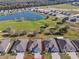 Aerial view of the house showing a beautiful view and proximity to the golf course and pond at 8843 Sw 57Th Place Rd, Ocala, FL 34481