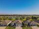 Aerial view of the houses looking over the lake and golf course at 8843 Sw 57Th Place Rd, Ocala, FL 34481