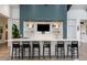 Stylish bar area with seating, sleek countertops, and ample space for entertaining at 8843 Sw 57Th Place Rd, Ocala, FL 34481