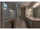 Spacious bathroom featuring double sink vanity, stone countertops, and modern lighting at 8843 Sw 57Th Place Rd, Ocala, FL 34481
