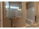 Modern bathroom showcasing tiled walk-in shower with glass partition and separate built-in tiled bench at 8843 Sw 57Th Place Rd, Ocala, FL 34481