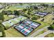 Aerial view showcasing a variety of courts in the community, including tennis and pickleball at 8843 Sw 57Th Place Rd, Ocala, FL 34481