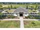 Overhead view of a neighborhood's community garden with plots surrounding a central building at 8843 Sw 57Th Place Rd, Ocala, FL 34481
