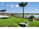 Cornhole setup on grassy lawn near lake at 8843 Sw 57Th Place Rd, Ocala, FL 34481