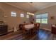 Dining room with table and chairs, wood floors, natural lighting at 8843 Sw 57Th Place Rd, Ocala, FL 34481