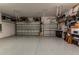Spacious garage with epoxy flooring, lift system, and ample storage, designed for car enthusiasts at 8843 Sw 57Th Place Rd, Ocala, FL 34481