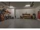 Organized garage featuring epoxy floors, tool bench, and storage, providing ample space for projects at 8843 Sw 57Th Place Rd, Ocala, FL 34481