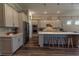 Contemporary kitchen with stainless steel appliances, gray cabinets, and a large kitchen island at 8843 Sw 57Th Place Rd, Ocala, FL 34481