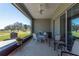 Inviting screened lanai with comfortable seating and serene golf course views, perfect for relaxation at 8843 Sw 57Th Place Rd, Ocala, FL 34481