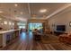 Open floor plan with an airy living room that features hardwood floors and a large window at 8843 Sw 57Th Place Rd, Ocala, FL 34481
