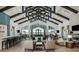 Expansive lounge area with high ceilings, elegant seating, and large windows offering scenic views of the community at 8843 Sw 57Th Place Rd, Ocala, FL 34481