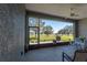 Relaxing screened patio with a ceiling fan, table, and chairs overlooking the golf course at 8843 Sw 57Th Place Rd, Ocala, FL 34481