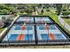 Aerial view of pickleball courts for recreational play in a gated community at 8843 Sw 57Th Place Rd, Ocala, FL 34481