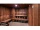 Inviting wooden sauna with multi-level bench seating for a therapeutic experience at 8843 Sw 57Th Place Rd, Ocala, FL 34481