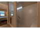 Modern bathroom features glass enclosed shower with bench and subway tile at 8843 Sw 57Th Place Rd, Ocala, FL 34481