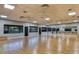 Bright studio with hardwood floors, mirrored walls, and ballet bar for fitness activities at 8843 Sw 57Th Place Rd, Ocala, FL 34481