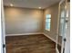 Bedroom featuring sleek hardwood floors and neutral wall paint at 10314 Sw 96Th Loop, Ocala, FL 34481