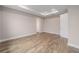 Neutral bedroom features a tray ceiling, modern lighting, and light colored floors at 10314 Sw 96Th Loop, Ocala, FL 34481