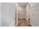 Walk-in closet with wire shelving and wood-grain flooring at 10314 Sw 96Th Loop, Ocala, FL 34481