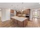 Bright kitchen showcasing a central island, stainless steel appliances, and ample cabinet space at 10314 Sw 96Th Loop, Ocala, FL 34481