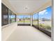 Screened patio with view of manicured lawns, other homes, and blue skies at 10314 Sw 96Th Loop, Ocala, FL 34481