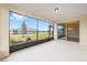 Screened patio overlooking the yard with an open doorway at 10314 Sw 96Th Loop, Ocala, FL 34481