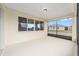 Screened patio with a view of a manicured lawn and other homes at 10314 Sw 96Th Loop, Ocala, FL 34481