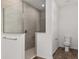 Modern bathroom featuring a glass-enclosed shower with tile surround and a toilet at 10557 Sw 98Th Ln, Ocala, FL 34481