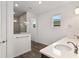 Bathroom with double sinks and shower at 10557 Sw 98Th Ln, Ocala, FL 34481