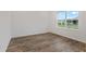 Bright bedroom features hardwood floors and a view from the window at 10557 Sw 98Th Ln, Ocala, FL 34481