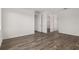 Bedroom with wood floors and 2 open doors to closets at 10557 Sw 98Th Ln, Ocala, FL 34481