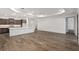 Bright, open living area features wood floors and access to the modern kitchen at 10557 Sw 98Th Ln, Ocala, FL 34481