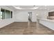 Open-concept living room features hardwood floors and recessed lighting throughout the home at 10557 Sw 98Th Ln, Ocala, FL 34481