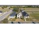 Aerial view of a two-story home in a well-planned community at 10597 Grand Oaks Blvd, Oxford, FL 34484