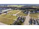 Community aerial view featuring manicured lawns and an inviting neighborhood layout at 10597 Grand Oaks Blvd, Oxford, FL 34484