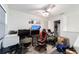 Bedroom featuring a ceiling fan and a workstation at 10597 Grand Oaks Blvd, Oxford, FL 34484