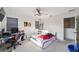Bedroom featuring a ceiling fan and a white bed frame with desk and chair at 10597 Grand Oaks Blvd, Oxford, FL 34484