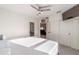 Spacious bedroom with ceiling fan, ensuite bathroom and closet at 10597 Grand Oaks Blvd, Oxford, FL 34484