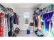 Walk-in closet featuring rod and shelf organization at 10597 Grand Oaks Blvd, Oxford, FL 34484