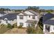 Attractive two-story home with well-maintained lawn and inviting front porch at 10597 Grand Oaks Blvd, Oxford, FL 34484