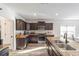 Bright kitchen featuring stainless steel appliances, granite countertops, and ample counter space at 10597 Grand Oaks Blvd, Oxford, FL 34484