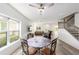 Inviting living room with large windows, dining area, and cozy seating arrangements at 10597 Grand Oaks Blvd, Oxford, FL 34484