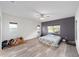 Bright main bedroom with ample natural light and neutral decor at 10597 Grand Oaks Blvd, Oxford, FL 34484