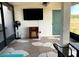 Screened-in patio with decorative stone flooring and outdoor seating at 10597 Grand Oaks Blvd, Oxford, FL 34484