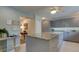 A neutral colored kitchen is complete with granite countertops, stainless appliances, and great lighting at 11720 Cherokee Cir, Dunnellon, FL 34431