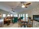 Expansive living area with stone fireplace, cozy seating, and open layout at 11720 Cherokee Cir, Dunnellon, FL 34431