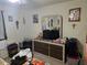 Untidy bedroom with bed, nightstand, closet, dresser, and ceiling fan at 11860 Nw 18Th Pl, Ocala, FL 34482