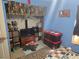 Bedroom interior featuring eclectic decor, a large TV and a storage area at 11860 Nw 18Th Pl, Ocala, FL 34482